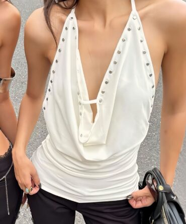 Features An Asymmetric Ruffled Neckline And Tie Details